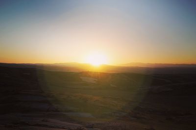 Scenic view of landscape at sunset