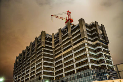 Low angle view of building under construction against sky