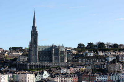 View of buildings in city against sky