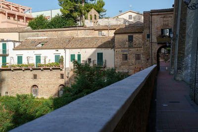 Footpath amidst buildings in town