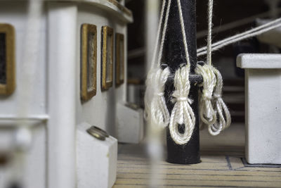 Close-up of rope tied up on metal door