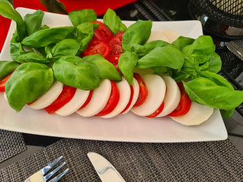 High angle view of fruits in plate on table