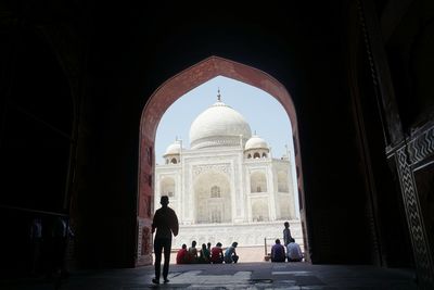 Taj mahal seen through archway