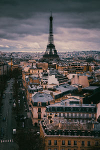 Cityscape against cloudy sky