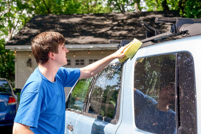 Man standing in car