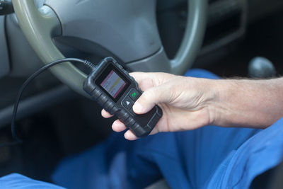 Close-up of man using mobile phone