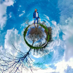 Digital composite image of woman standing against blue sky