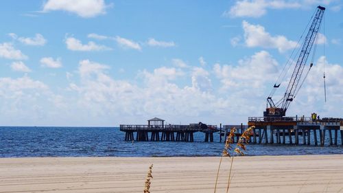 Pier over sea against sky