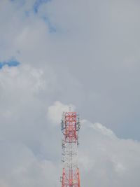 Low angle view of communications tower against sky