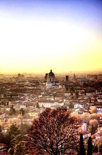 Buildings in city at sunset