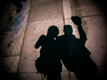 Shadow of people on wall