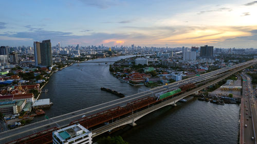 High angle view of bridge over river against sky during sunset