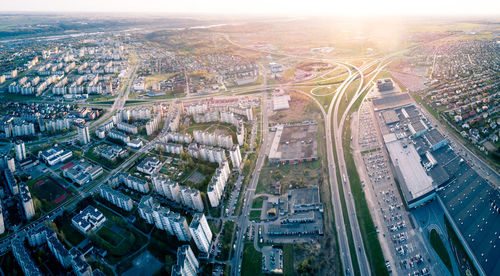 High angle view of illuminated street amidst buildings in city