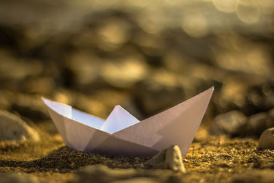 Close-up of paper flags on shore