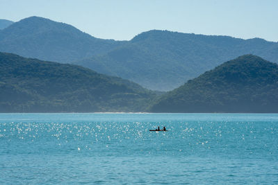 Scenic view of sea against mountains