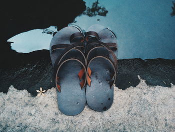 Low section of person on sea shore