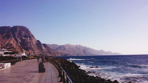 Scenic view of beach against clear sky