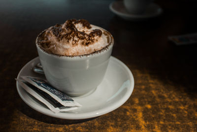 Close-up of coffee cup on table