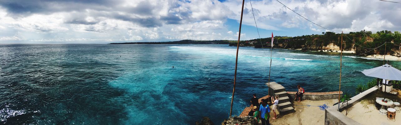 PANORAMIC VIEW OF BOATS SAILING IN SEA