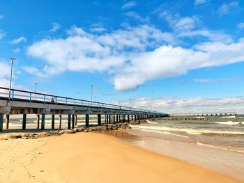 Bridge over sea against sky