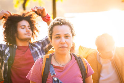 Unified stand multiracial millennials' sunset protest in nature