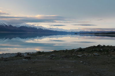 Scenic view of lake against sky during sunset