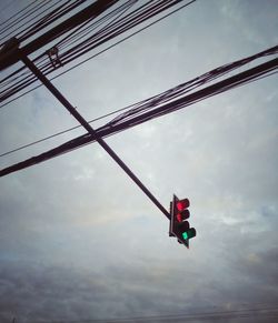 Low angle view of helicopter against sky