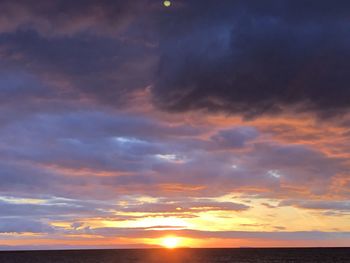 Low angle view of dramatic sky during sunset