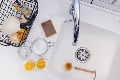 Top view of eco natural items for kitchen cleaning near the sink. 