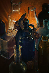 Close-up of old glass bottles on table