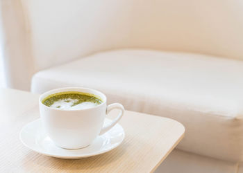 Close-up of coffee cup on table