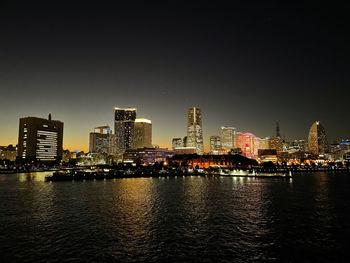 Illuminated city at waterfront