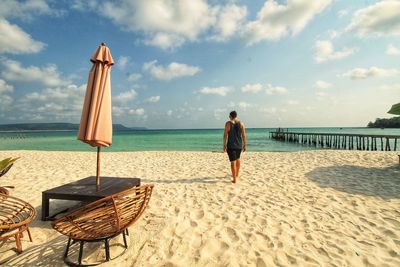 Rear view of man on beach