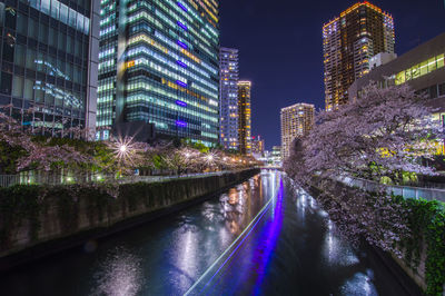 Illuminated buildings in city at night