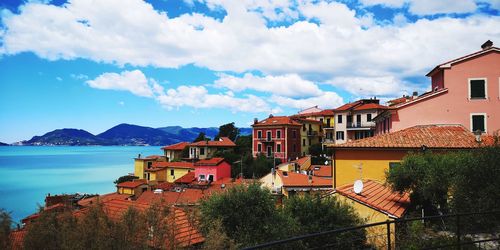 Buildings in town against sky