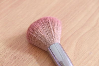 Close-up of make-up brush on table