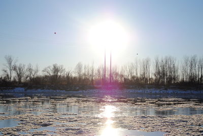Scenic view of lake at sunset