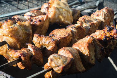 High angle view of meat on barbecue grill