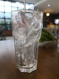 Close-up of ice glass on table
