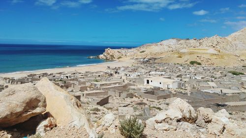 Scenic view of beach against blue sky