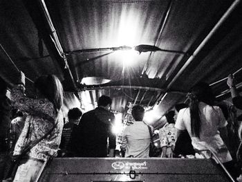 Low angle view of people on escalator