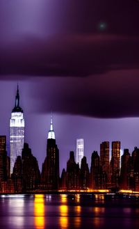 Illuminated buildings in city at night