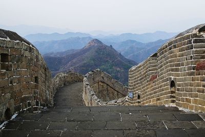 View of old building against mountain range