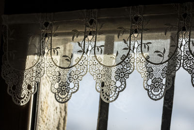 Close-up of curtain against window