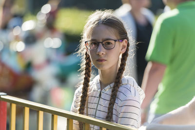 Portrait of girl looking away outdoors