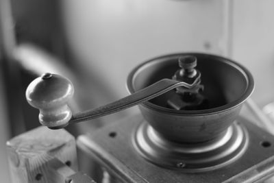 Close-up of old tea cup on table