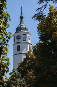 Low angle view of bell tower against sky