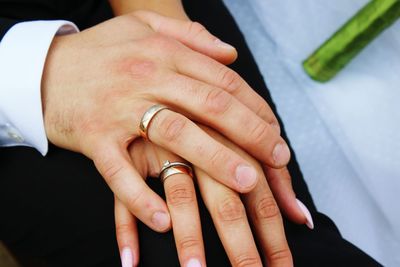 Cropped image of woman hands with rings