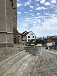 Houses in town against sky