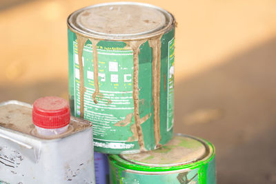 Close-up of stacked paint cans